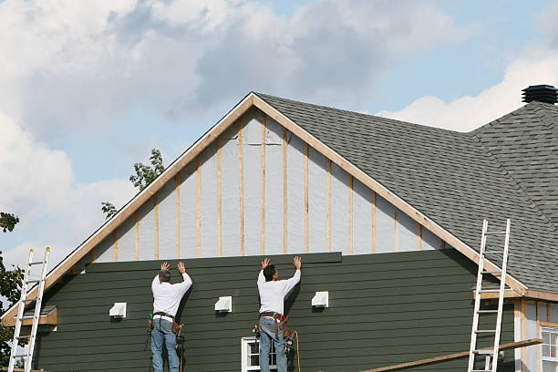 Professional Siding Contractor technician working in Holmesville, OH